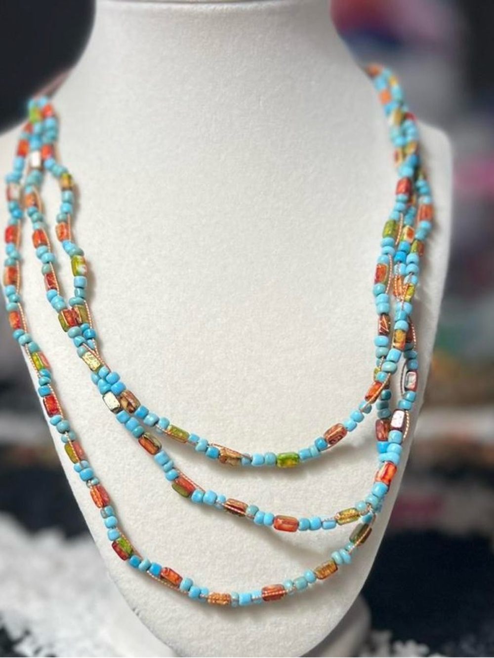 Multicoloured multilayered beaded necklace